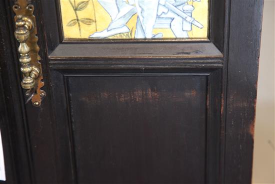 An Aesthetic movement ebonised music cabinet, in the manner of Morris & Co., W.30in.